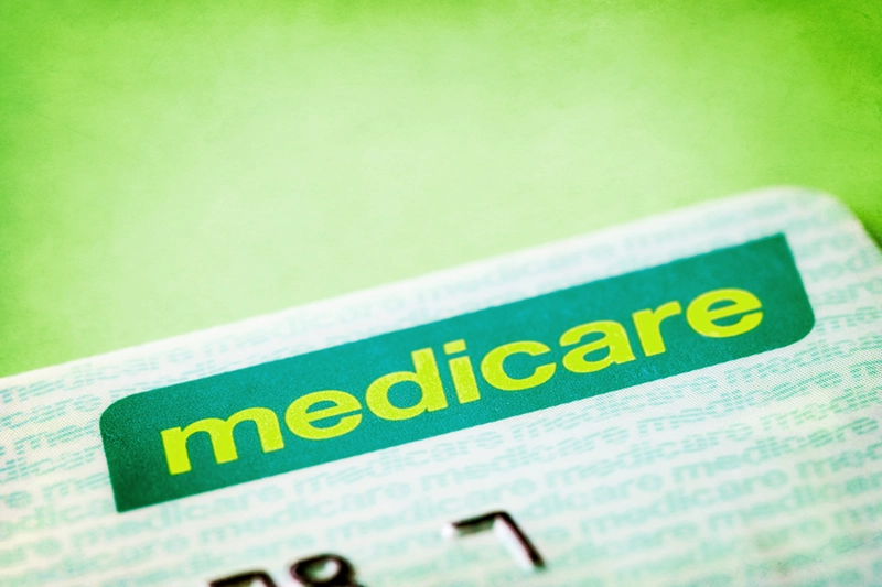 A medicare card with the word medicare on it.
